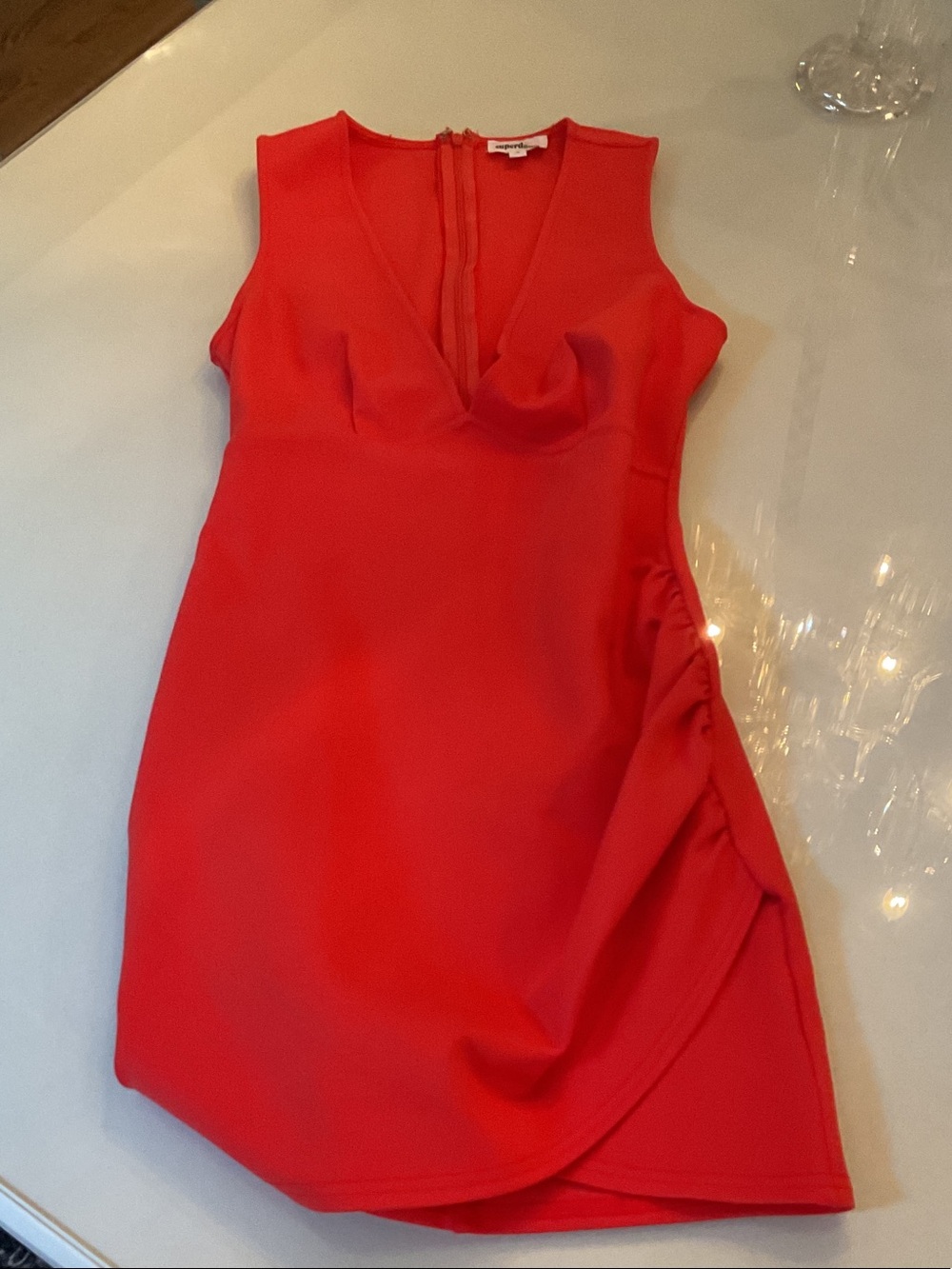 Low cut mini dress in size small orange